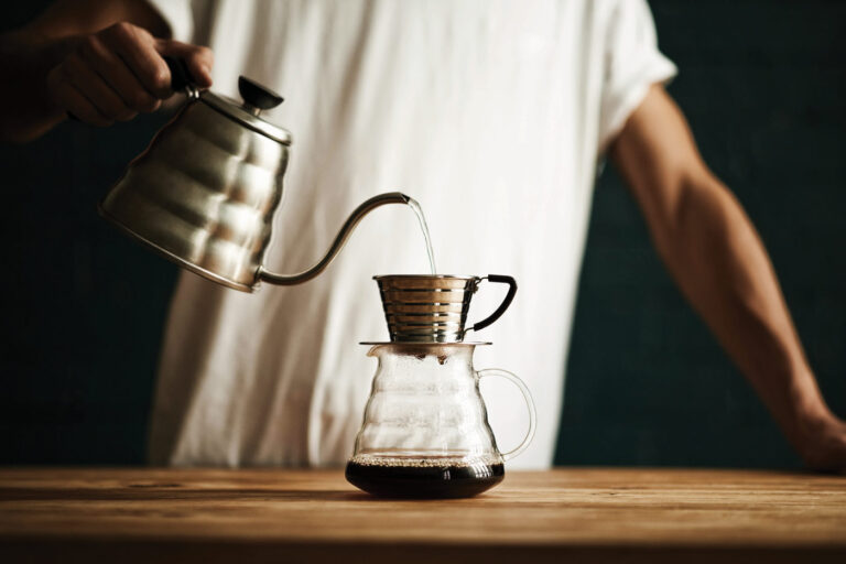 Barista pouring coffee