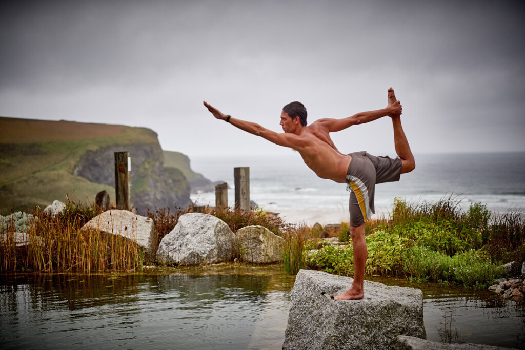 Sustainable staycations - The Scarlet - man doing yoga