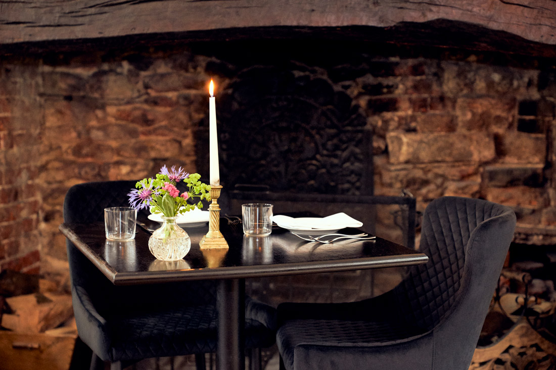 Candlelit table at The Ollerod in Dorset