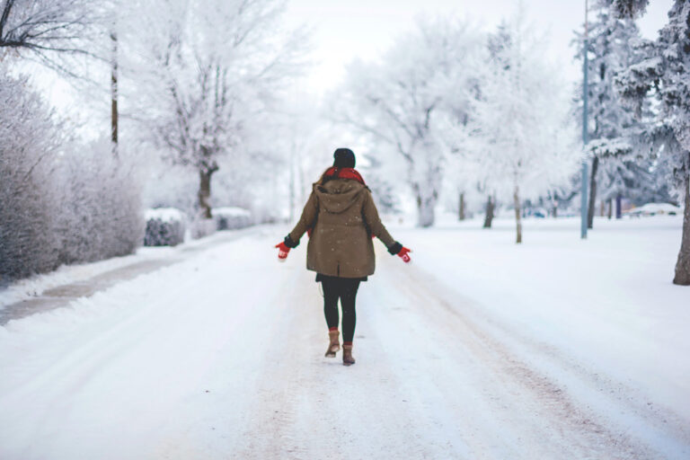 Girl in a wintery scene - how to survive winter