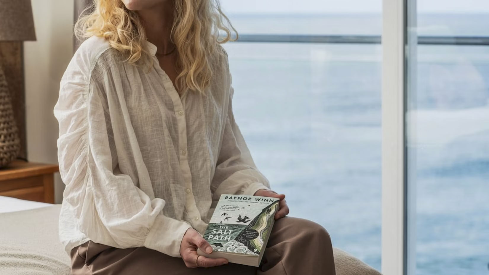 woman holding salt path book